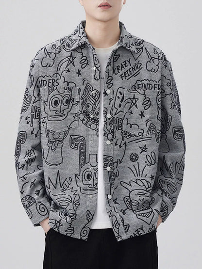 Person wearing a gray shirt with black doodle patterns on a white background