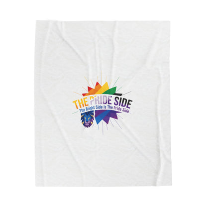 White blanket with rainbow-colored logo on a white background