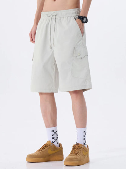 Person wearing white shorts and brown shoes on a white background